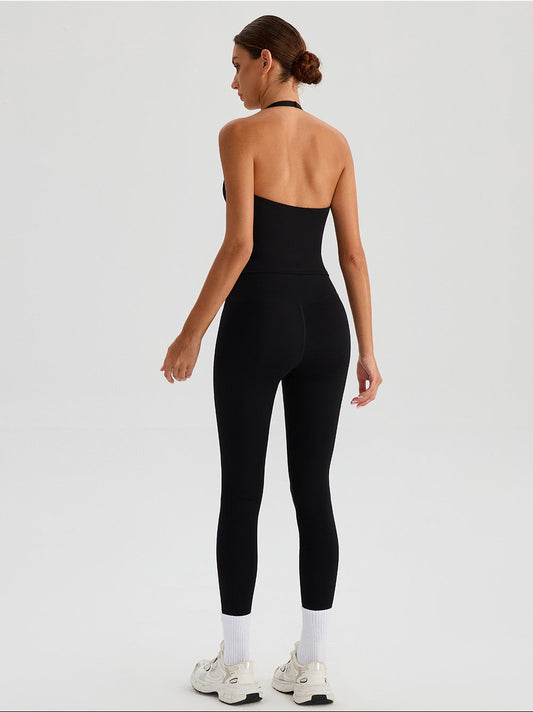 black open-back halter activewear top