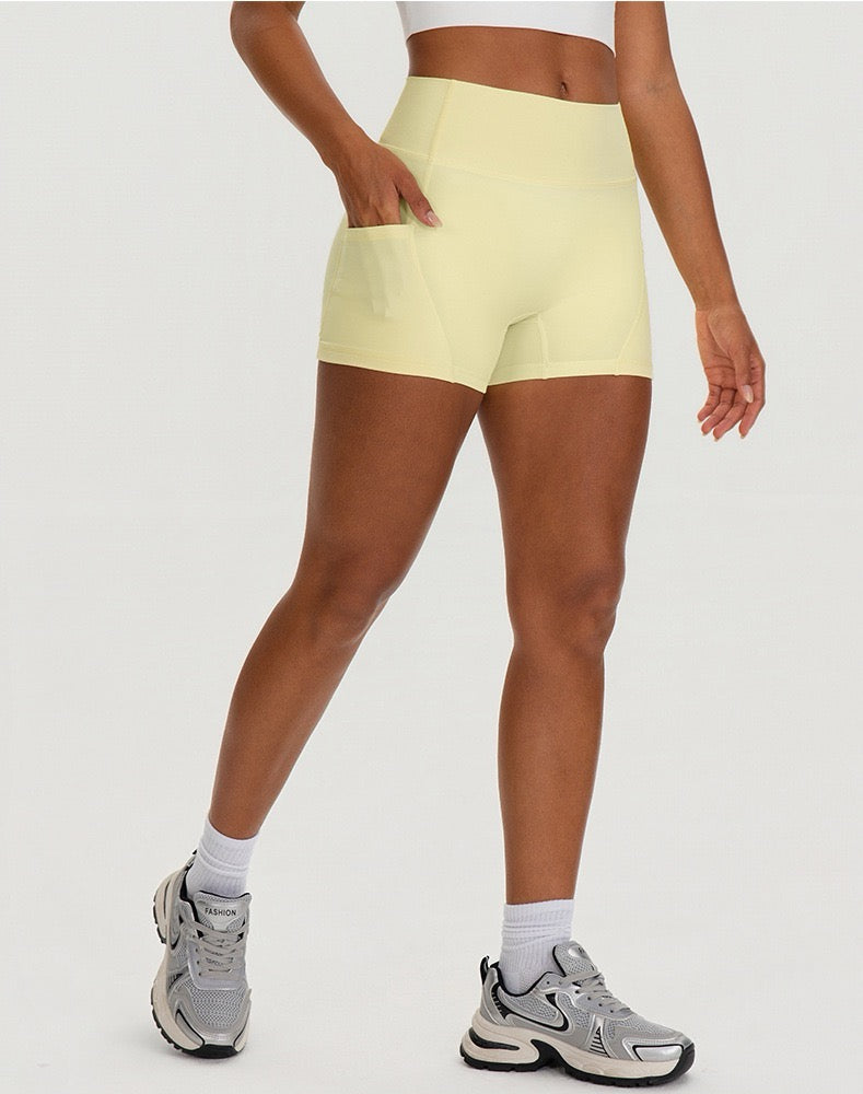 yellow mid-thigh workout shorts with pockets for women
