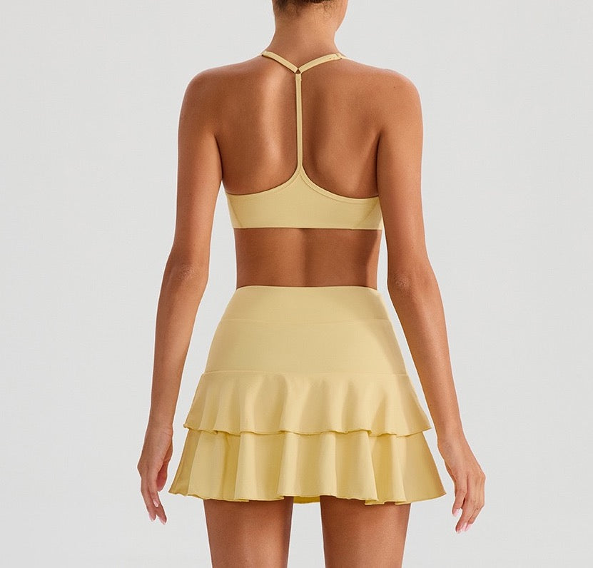Yellow tennis outfit set with a ruffled skirt 