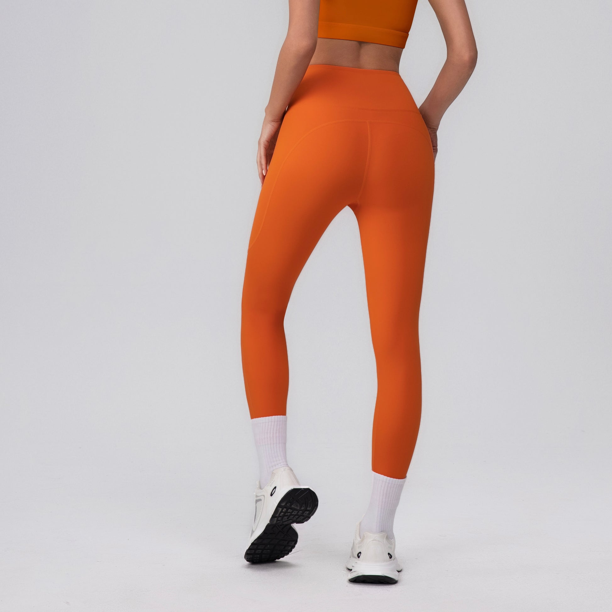 curve enhancing leggings in orange colour
