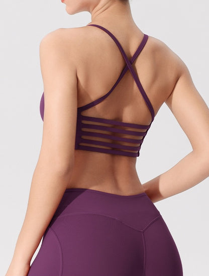 purple strappy cross-back sports bra