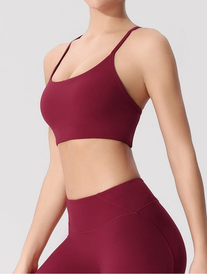 red cross-back sports bra